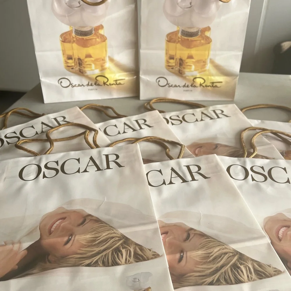 Oscar de la Renta gift bags with gold tone handles. New never used. Total 10.